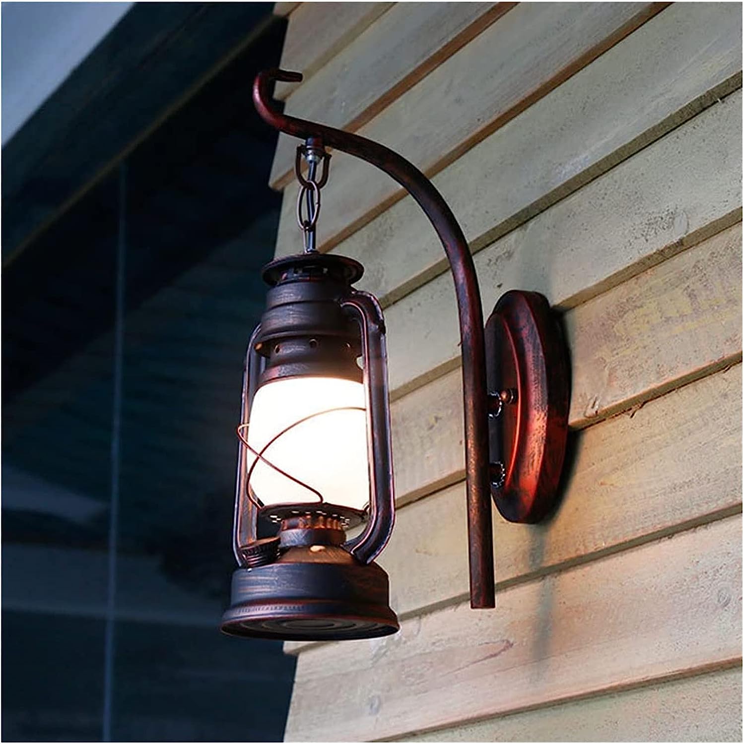 Close-up of the metal and glass design of the barn lantern wall lamp showcasing its elegant features.