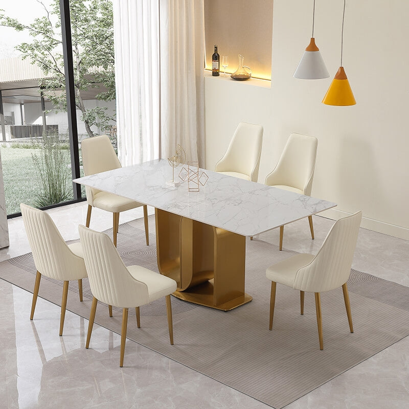 View of the elegant 71-inch sintered stone dining table set showcasing gold U-shaped pedestal base and contemporary chairs.