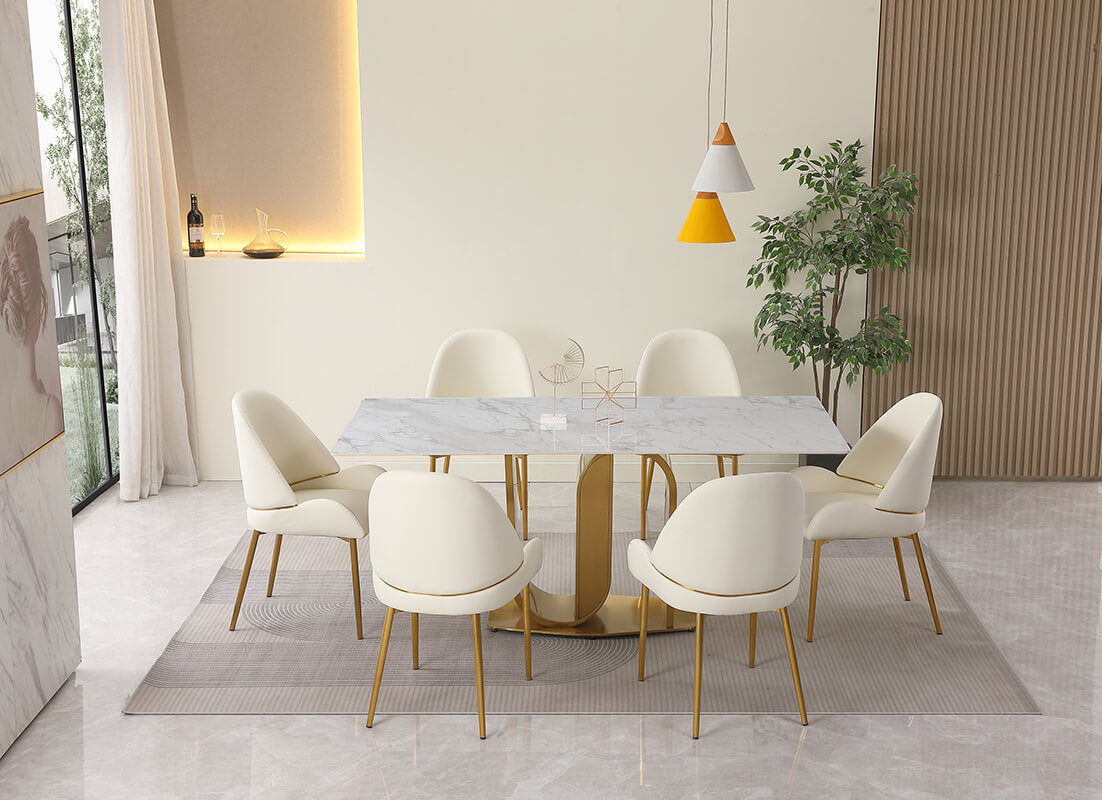 Close-up of the gold U-shape pedestal base supporting the sintered stone dining table.