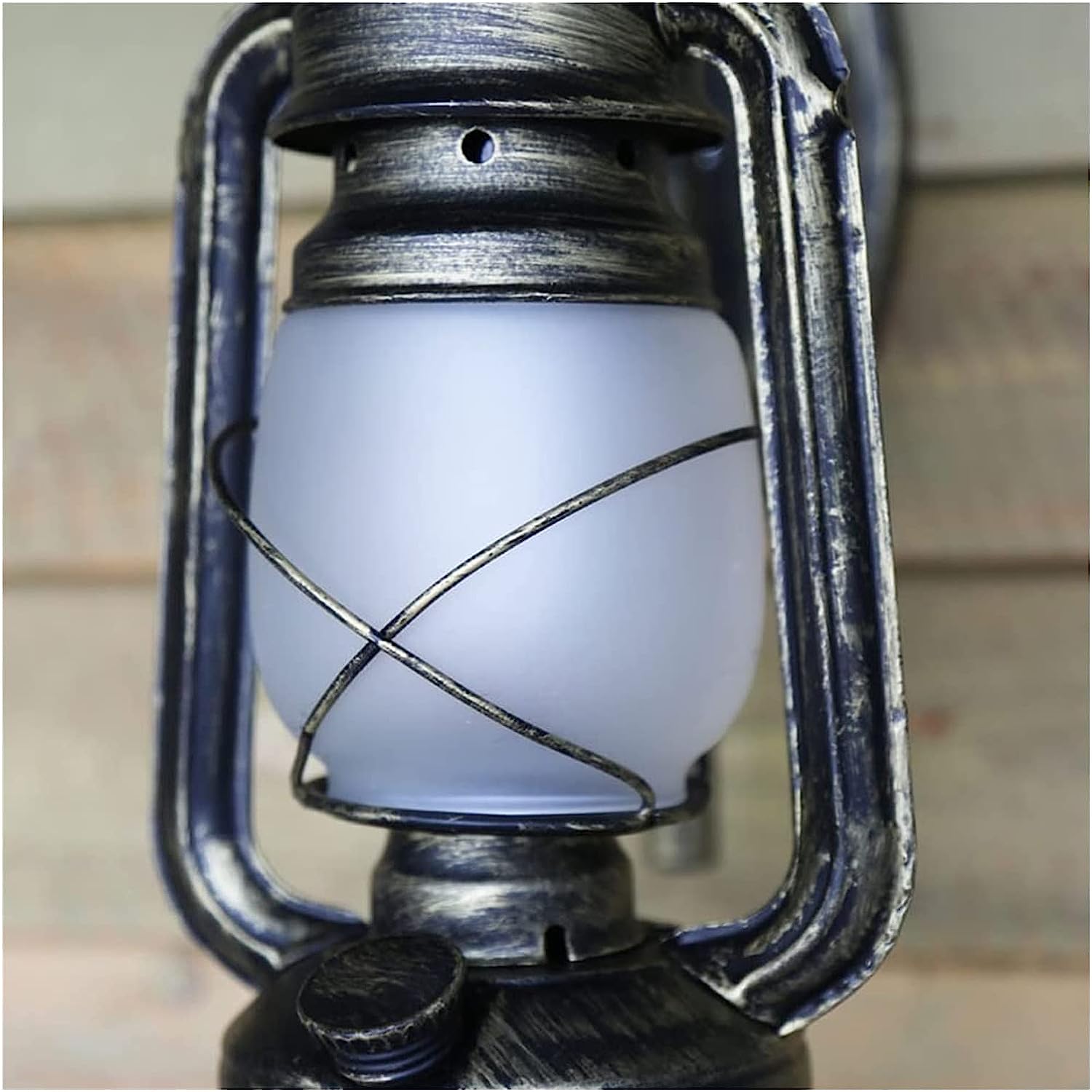 Rustic Vintage Barn Lantern Wall Light illuminating a stylish cafe interior.