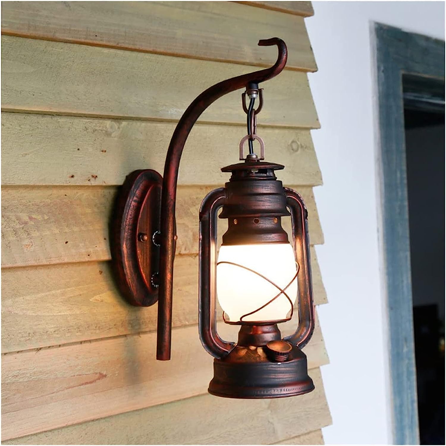 Rustic Vintage Barn Lantern Wall Light with frosted glass shade in a modern dining room setting.