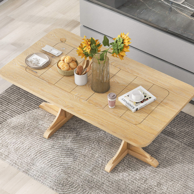 Close-up of curved legs on the wooden dining table, highlighting its craftsmanship.