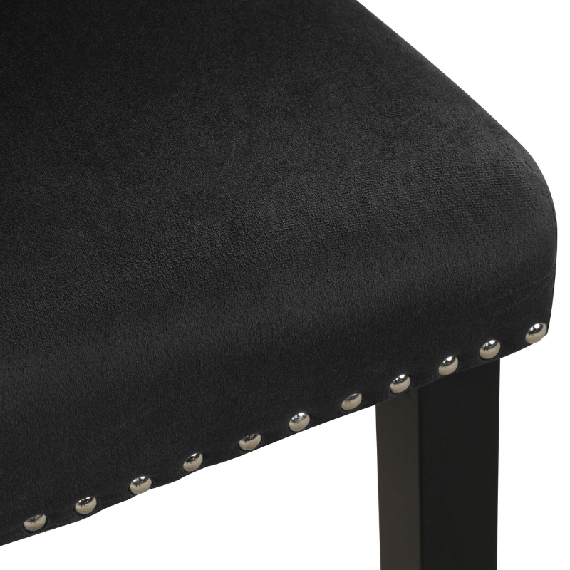 Close-up of the sleek faux marble dining table showcasing its luxurious finish and ample space for dining.