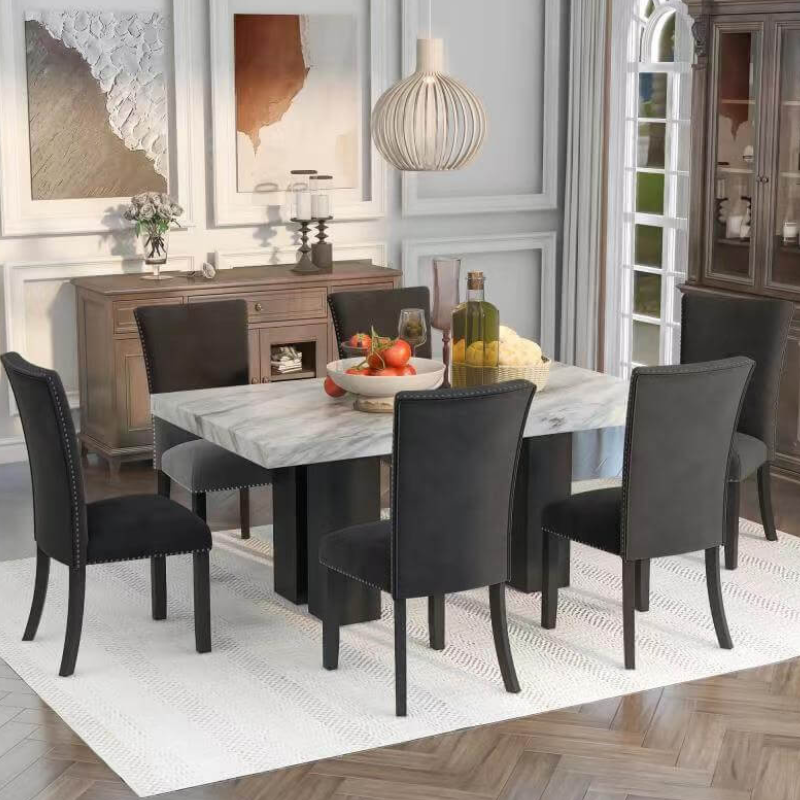 Close-up of the sleek faux marble dining table showcasing its luxurious finish and ample space for dining.