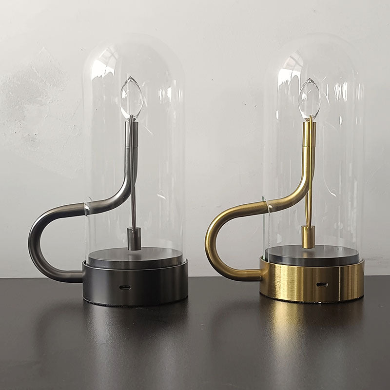 Close-up of the LED table lamp with candle flame effect highlighting its intricate glass design.