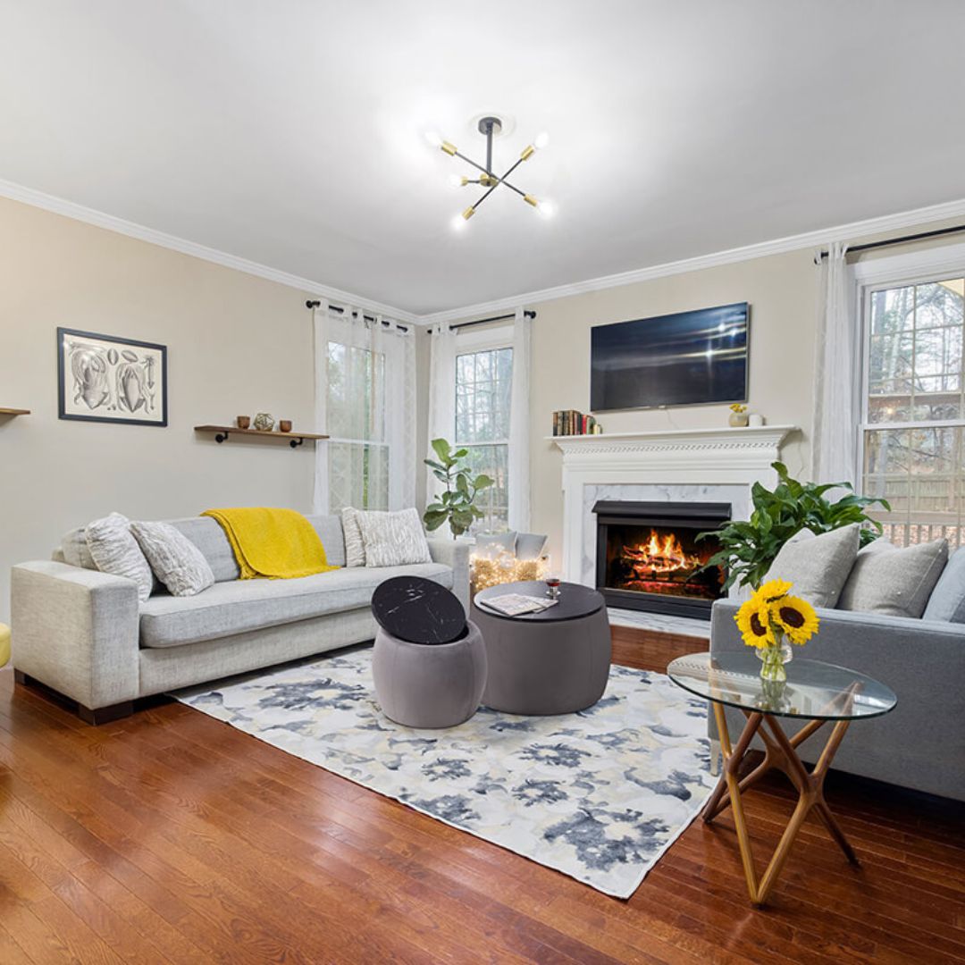 Elegant grey nesting round ottoman set displayed in a modern living room, showcasing its storage capability and style.