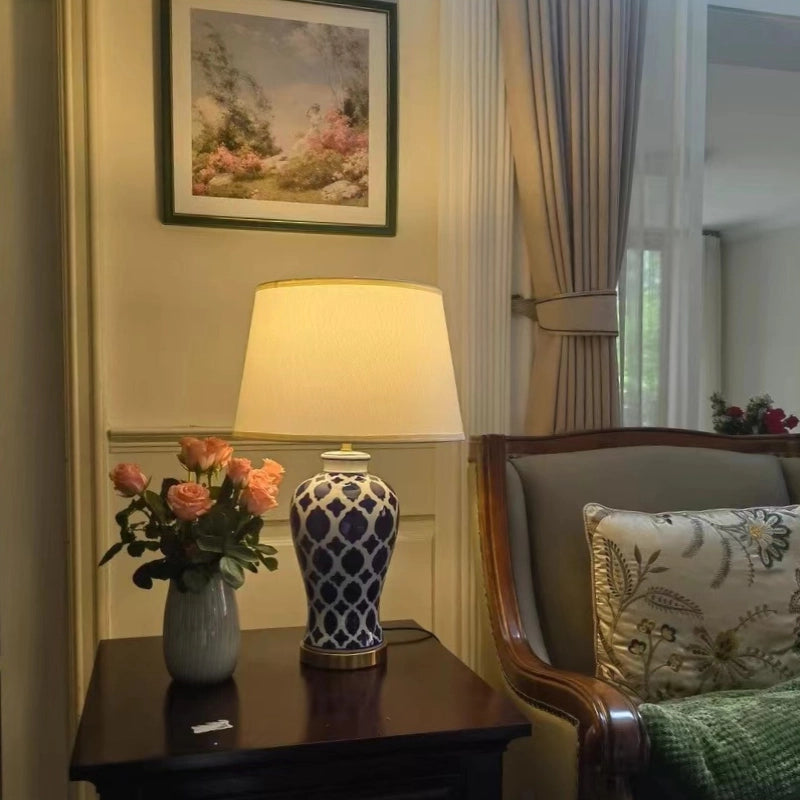 Front view of ceramic lamp showing hand-painted blue floral designs