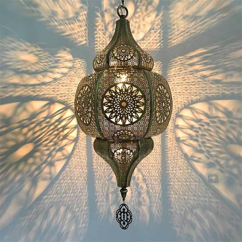 Moroccan vintage pendant light hanging in a dining room, showcasing its intricate designs.