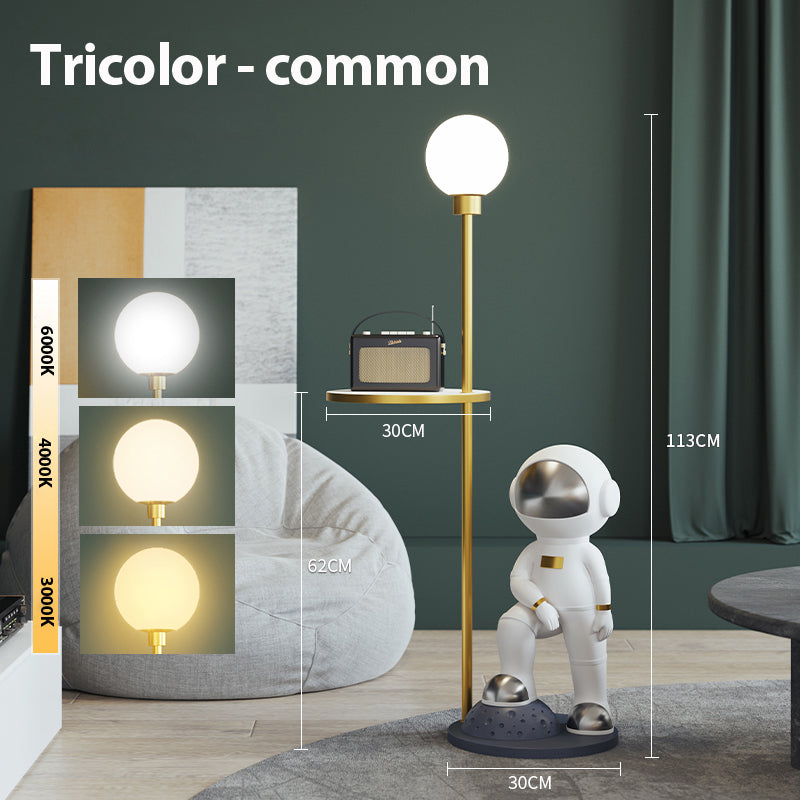 Close-up of the astronaut lamp showcasing its unique design and frosted glass shade.