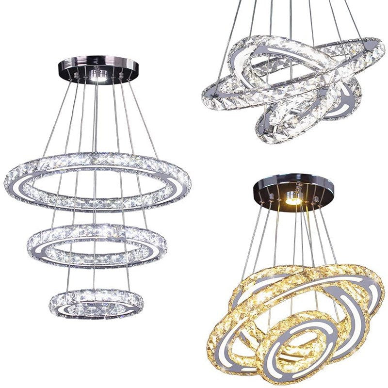Installation of the adjustable crystal pendant light in a high-ceiling living area.