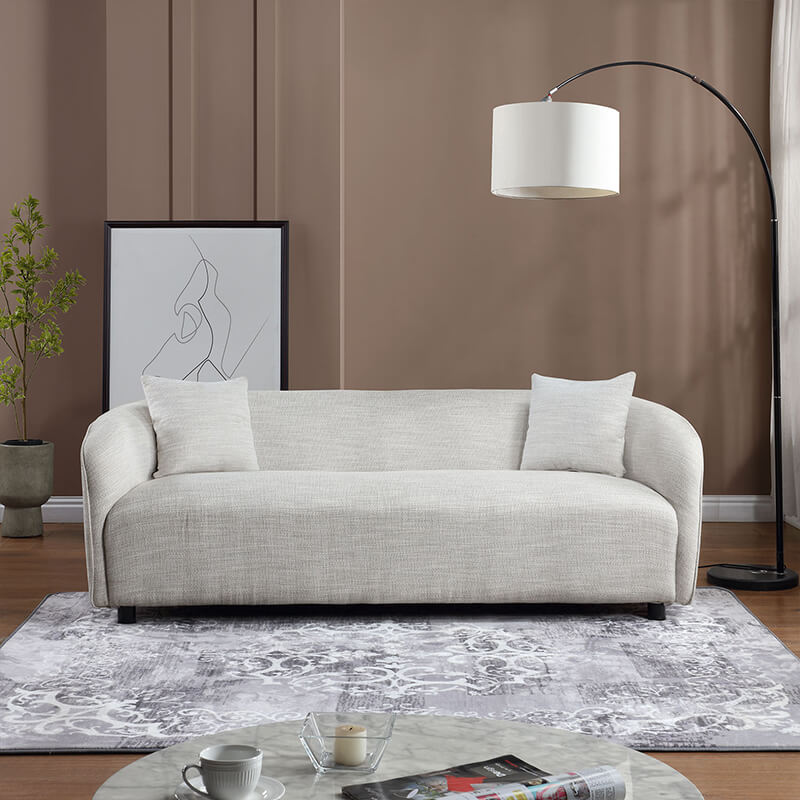 Side view of the gray curved boucle sofa, showcasing its elegant design.