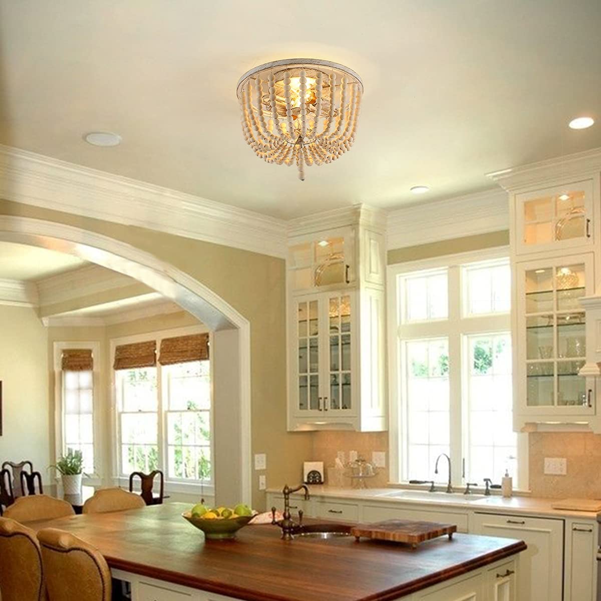 Rustic wood beaded ceiling light illuminating a cozy dining area.