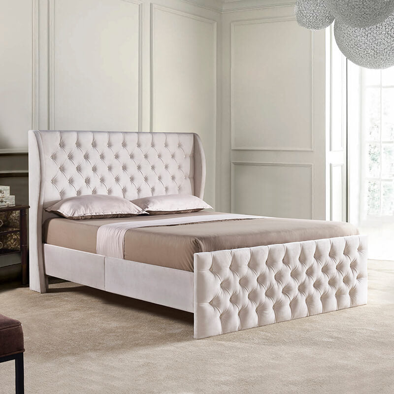 Side view of the king size velvet wingback bed frame showcasing the tufted headboard.