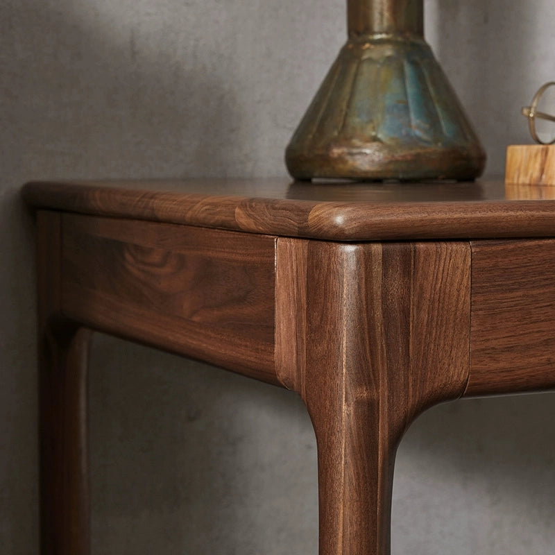 Compact walnut desk in a cozy workspace setting, ideal for writing and creative projects.