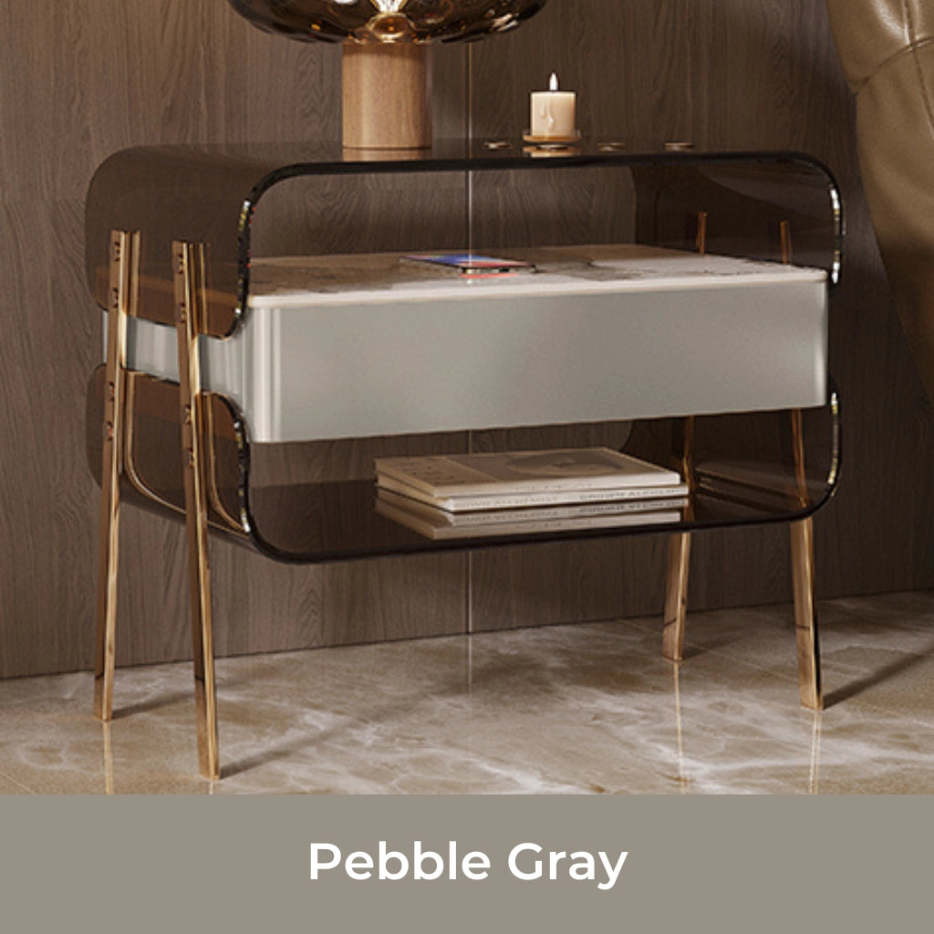 Side angle of modern acrylic nightstand with stainless steel legs and drawer.
