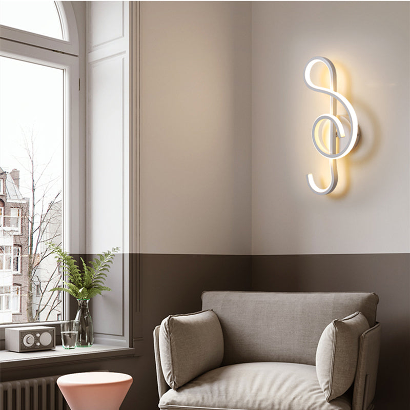 Close-up of black and white wall lamp showcasing acrylic shade and metal texture