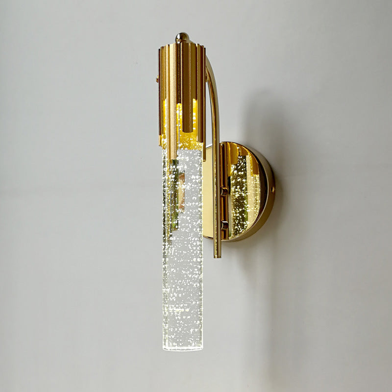 Elegant bubble glass wall sconce showcasing soft lighting in a stylish living room.