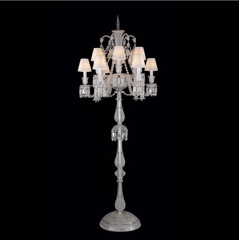 The sleek design of the crystal lamp adds charm to a well-decorated bedroom.