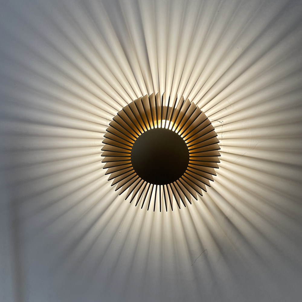 Elegant Industrial Flower Wall Lamp installed in a cozy bedroom, providing warm ambient lighting.