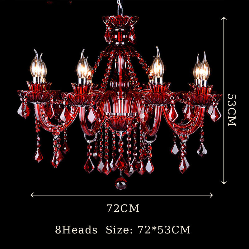 Beautifully lit European crystal chandelier in a modern living room setting.