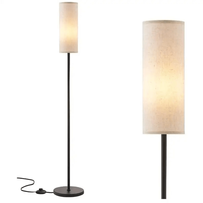 Elegant RGB floor lamp with linen shade illuminating a cozy living room corner.