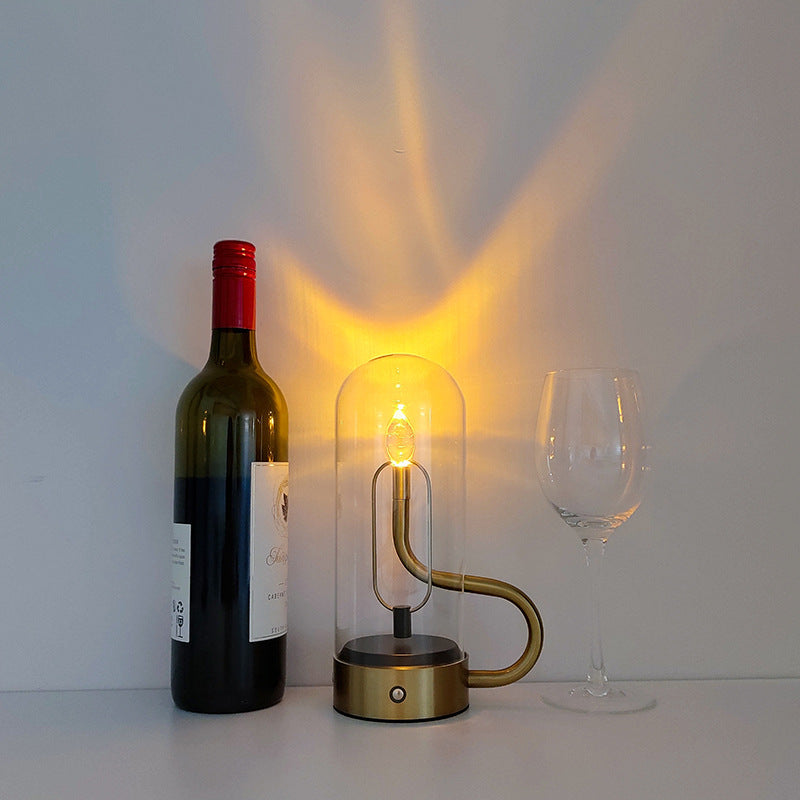 Luminous Flame Table Lamp on a bedside table, creating a warm ambiance in the bedroom.