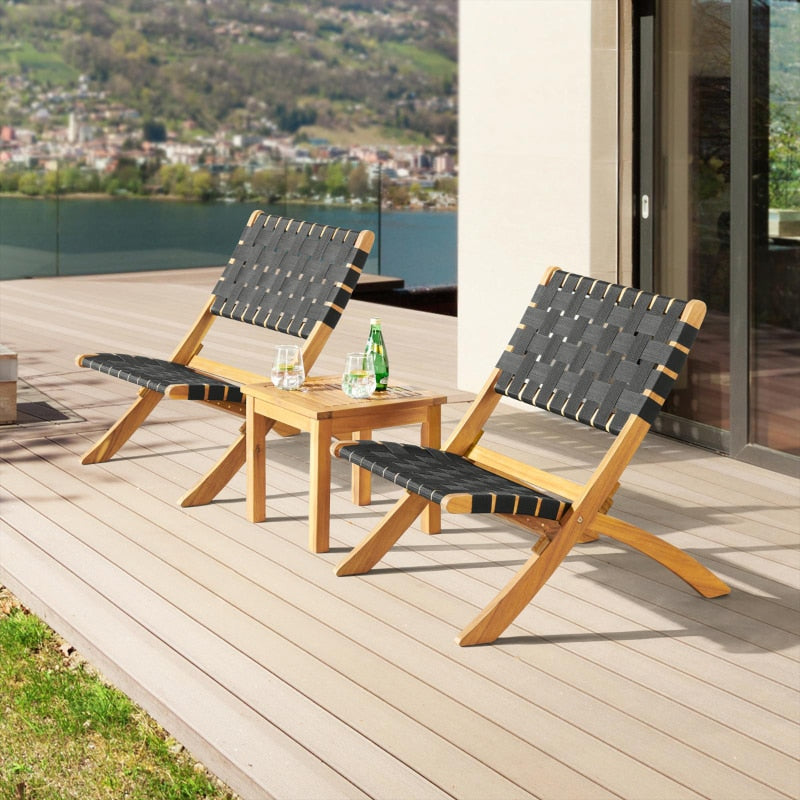 Close-up of black woven fabric and acacia wood finish of the patio furniture set.