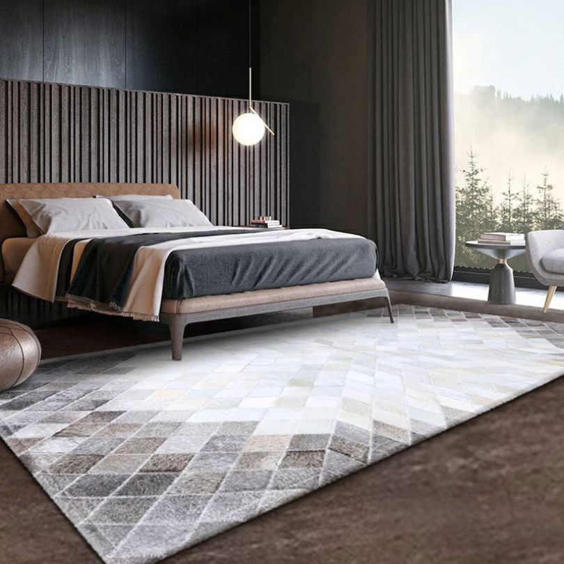 Close-up view of the luxurious texture of the handmade cowhide rug.