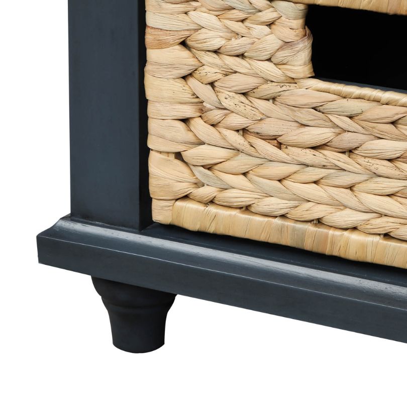 Close-up of rattan baskets under the antique blue entryway bench