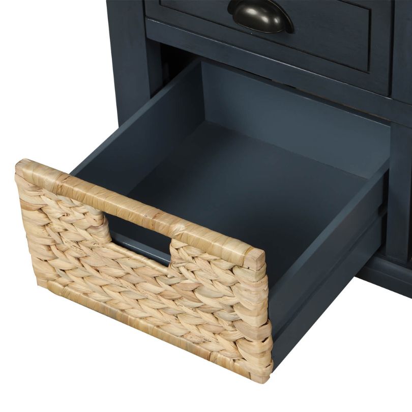 Antique blue entryway bench showcasing rattan baskets from a front angle