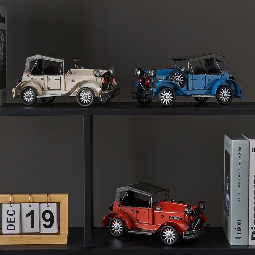 Vintage car decorative accessory in blue and red, showcasing its unique shape and design.
