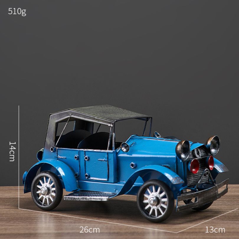 Close-up view of the antique car decor highlighting the metal craftsmanship and color palette.