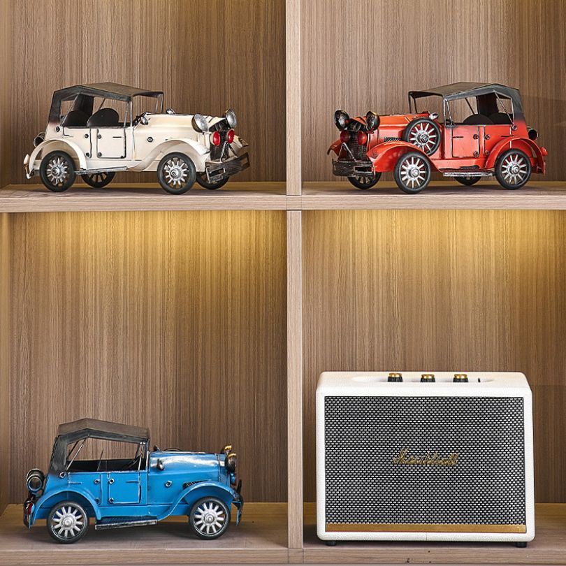 Vintage car decorative accessory in blue and red, showcasing its unique shape and design.