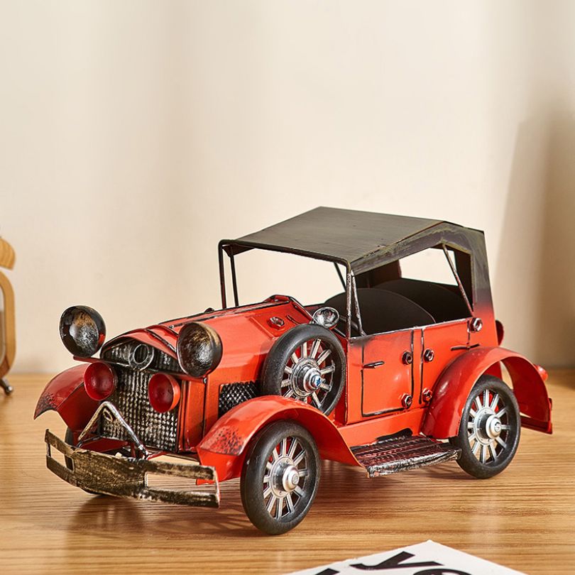Vintage car charm accessory displayed in a living room setting, enhancing the decor.