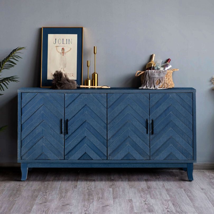 Vintage navy blue sideboard cabinet showcasing intricate detailing and four doors.