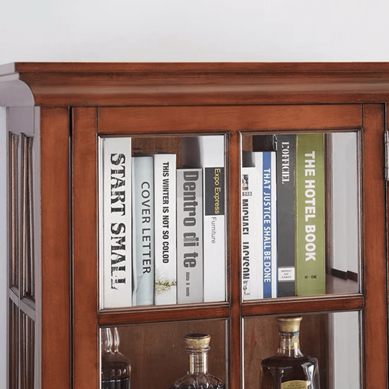 Elegant antique wine cabinet showcasing a wine collection through glass doors from a frontal view.