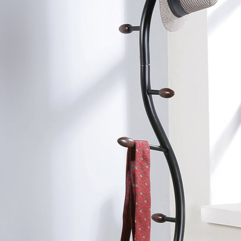 Close-up of the walnut finish and metal construction of the coat rack.