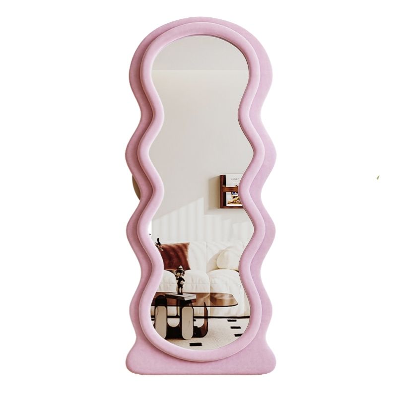 Full length mirror in a vibrant blue color, reflecting a bright and stylish bedroom interior