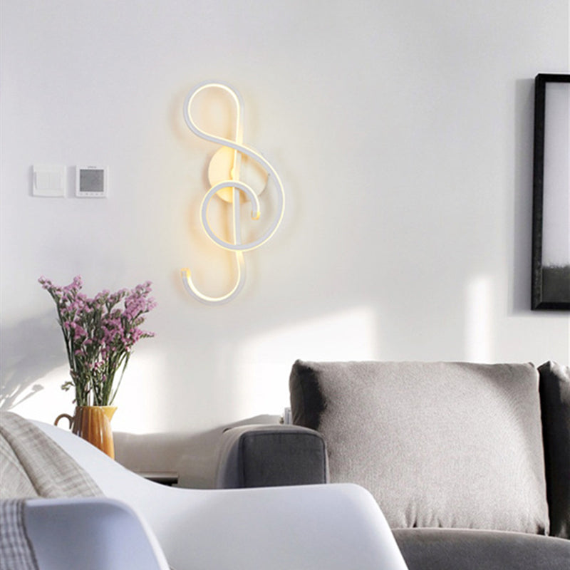 Front view of LED wall light illuminating a bedroom with soft upward glow