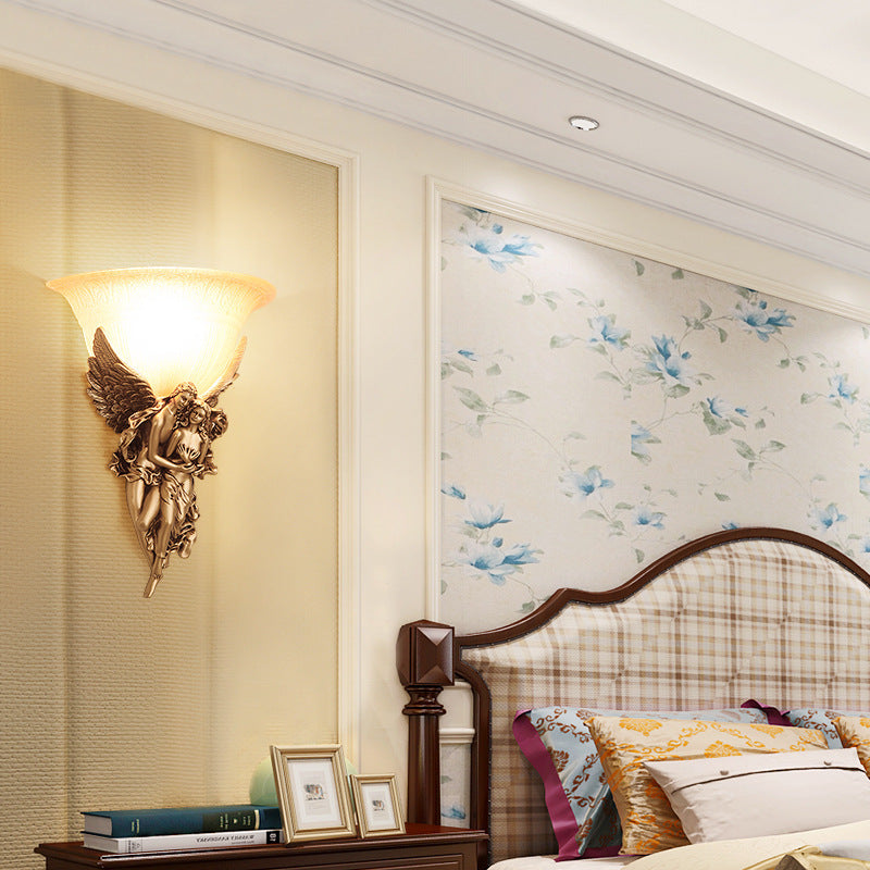 Close-up of the high quality glass shade of the angel wall light.