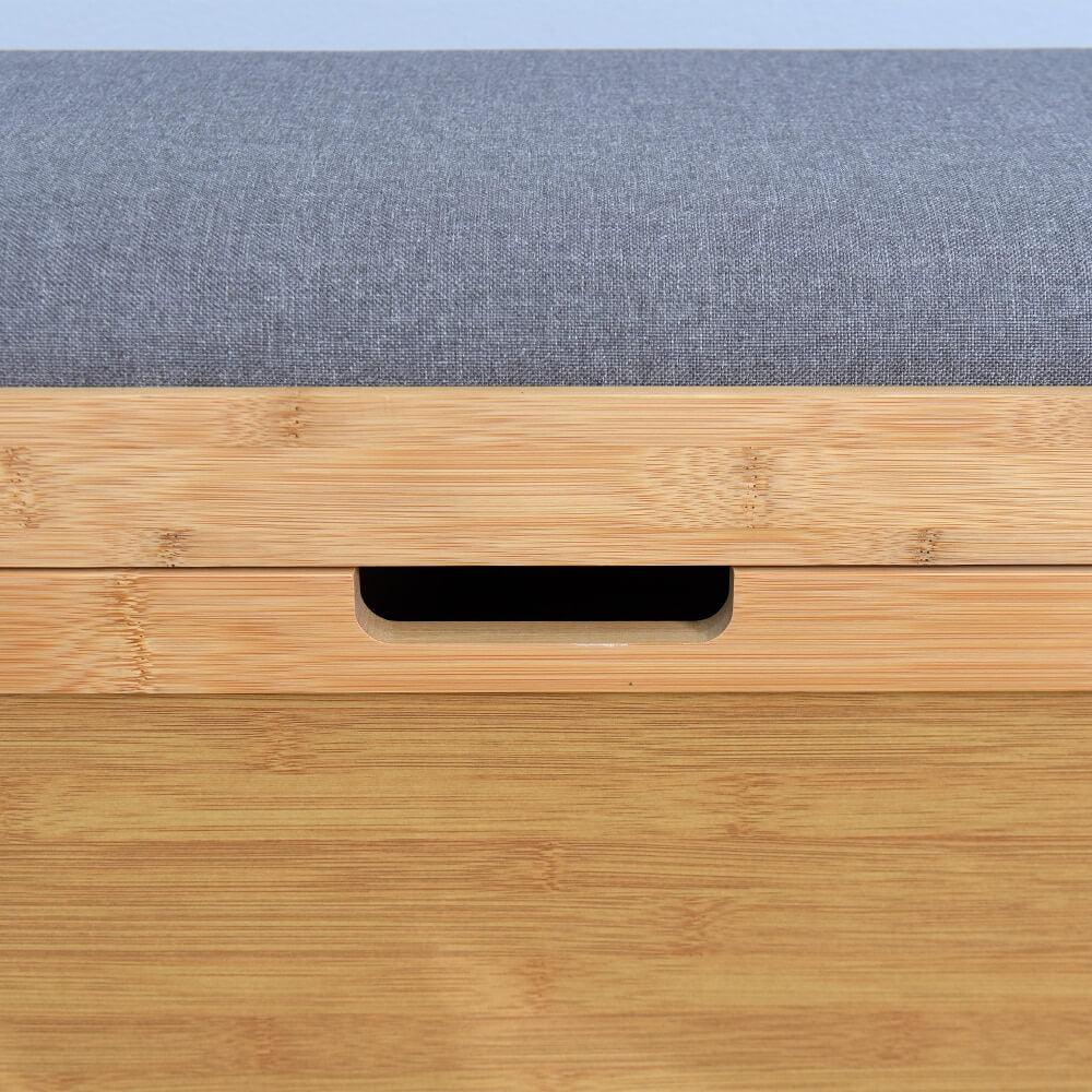 Stylish entryway setup featuring the bamboo storage bench, emphasizing its role in home organization.