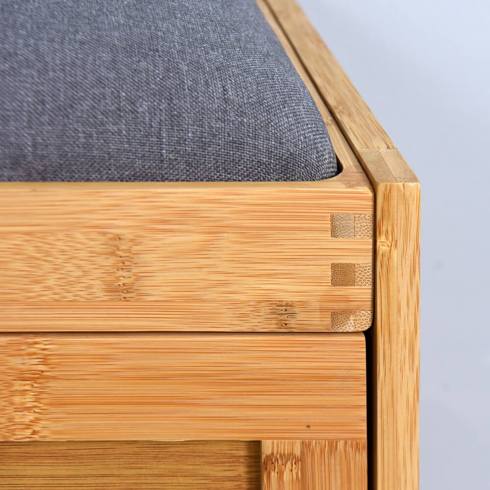 Elegant bamboo storage bench with flip drawer and padded seat in natural finish, showcasing its modern design and functionality.