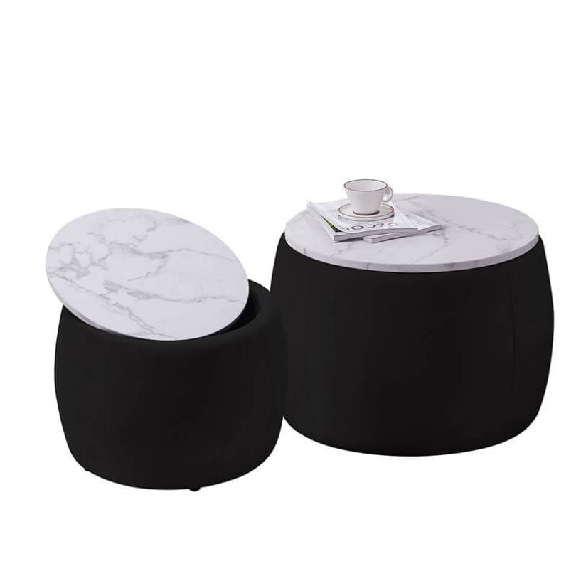 Top-down view of the black round ottoman with white wood tray lid in a cozy living room setup