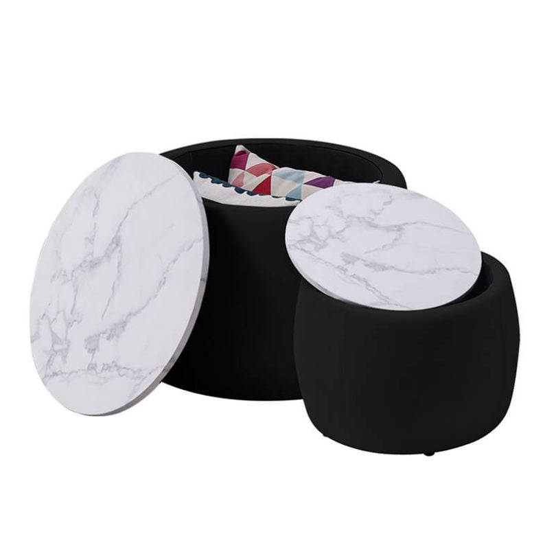 Set of two ottomans styled as footstools and side tables in modern bedroom