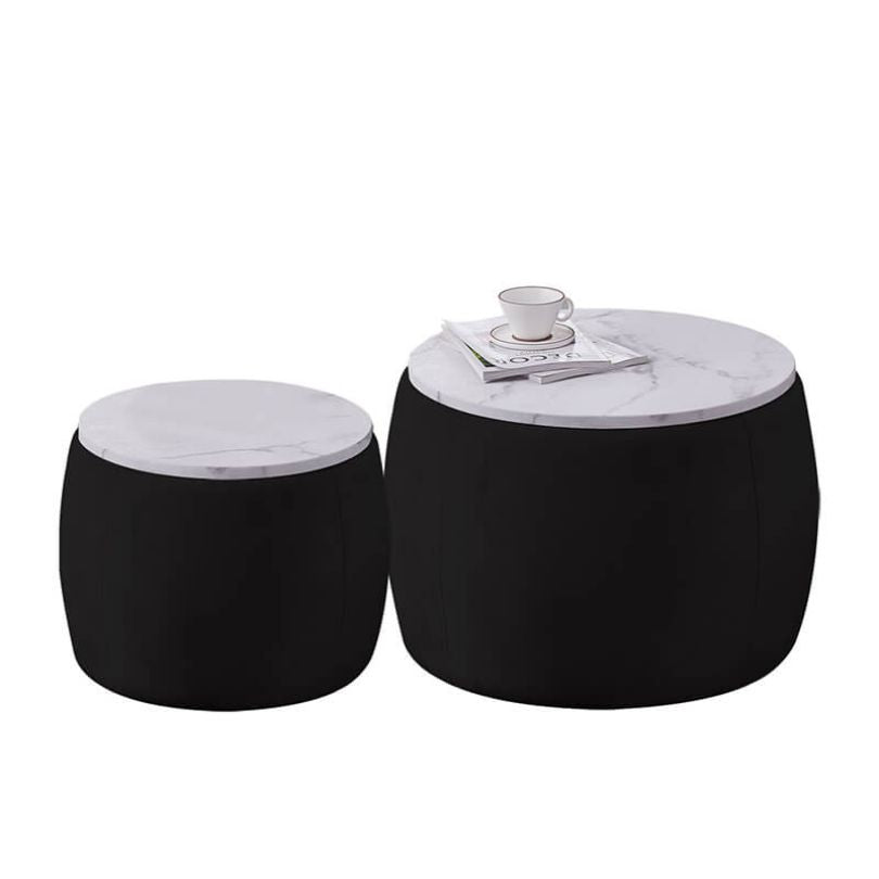 Top-down view of the black round ottoman with white wood tray lid in a cozy living room setup