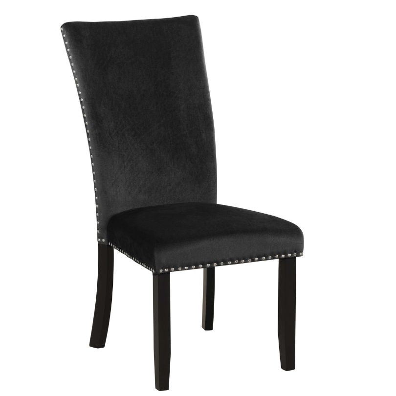 Elegant black velvet armless dining chair set showcasing nailhead trim from the side.