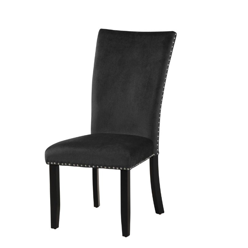 Close-up view of black velvet chair upholstery and rubber wood legs.