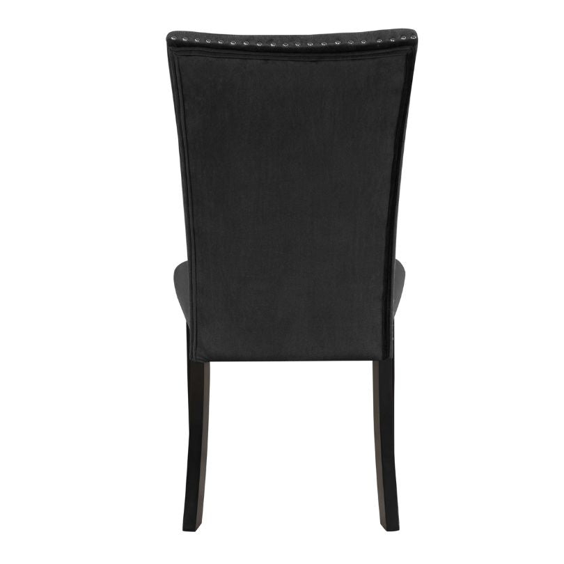 Close-up view of black velvet chair upholstery and rubber wood legs.