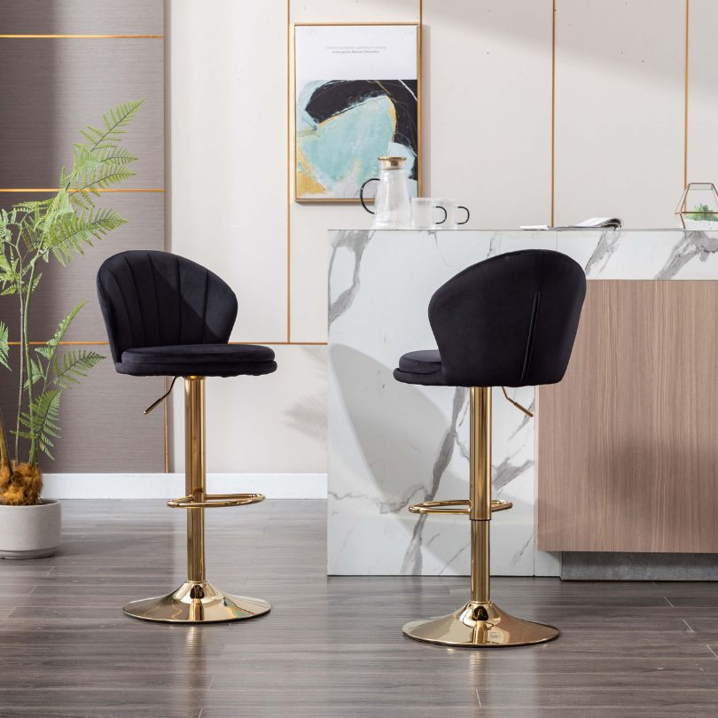 Close-up of the plush black velvet seat on the swivel stool.