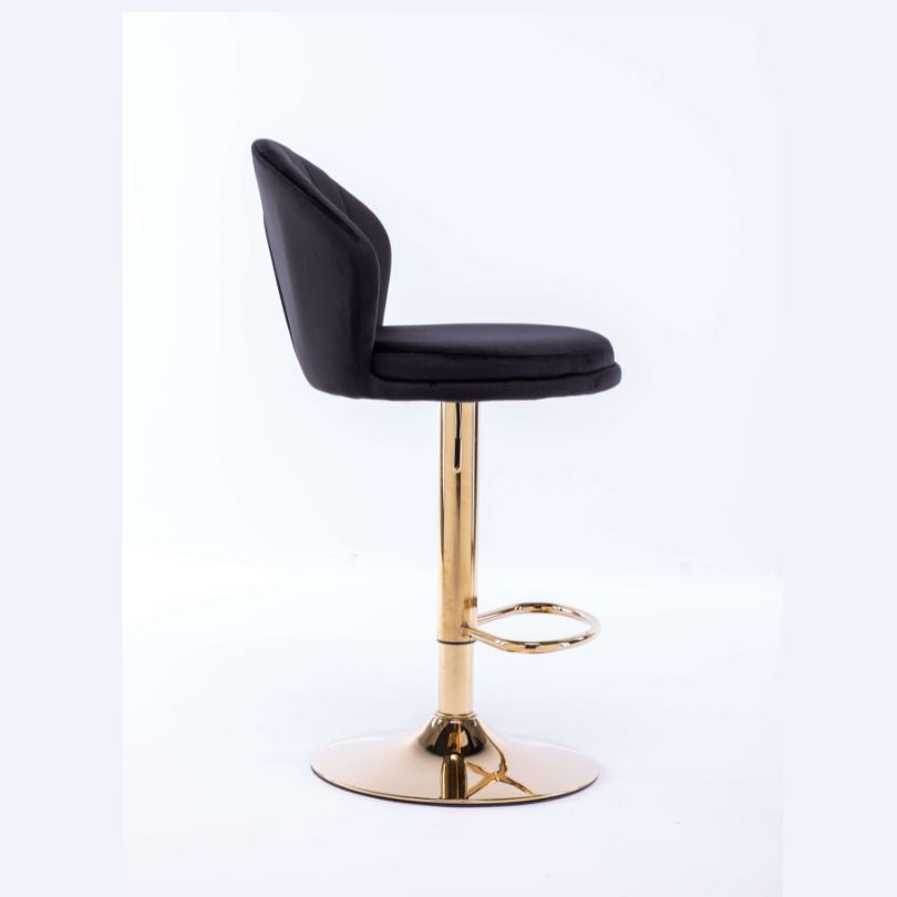 Lifestyle image of the black velvet swivel bar stool in a modern kitchen setting.